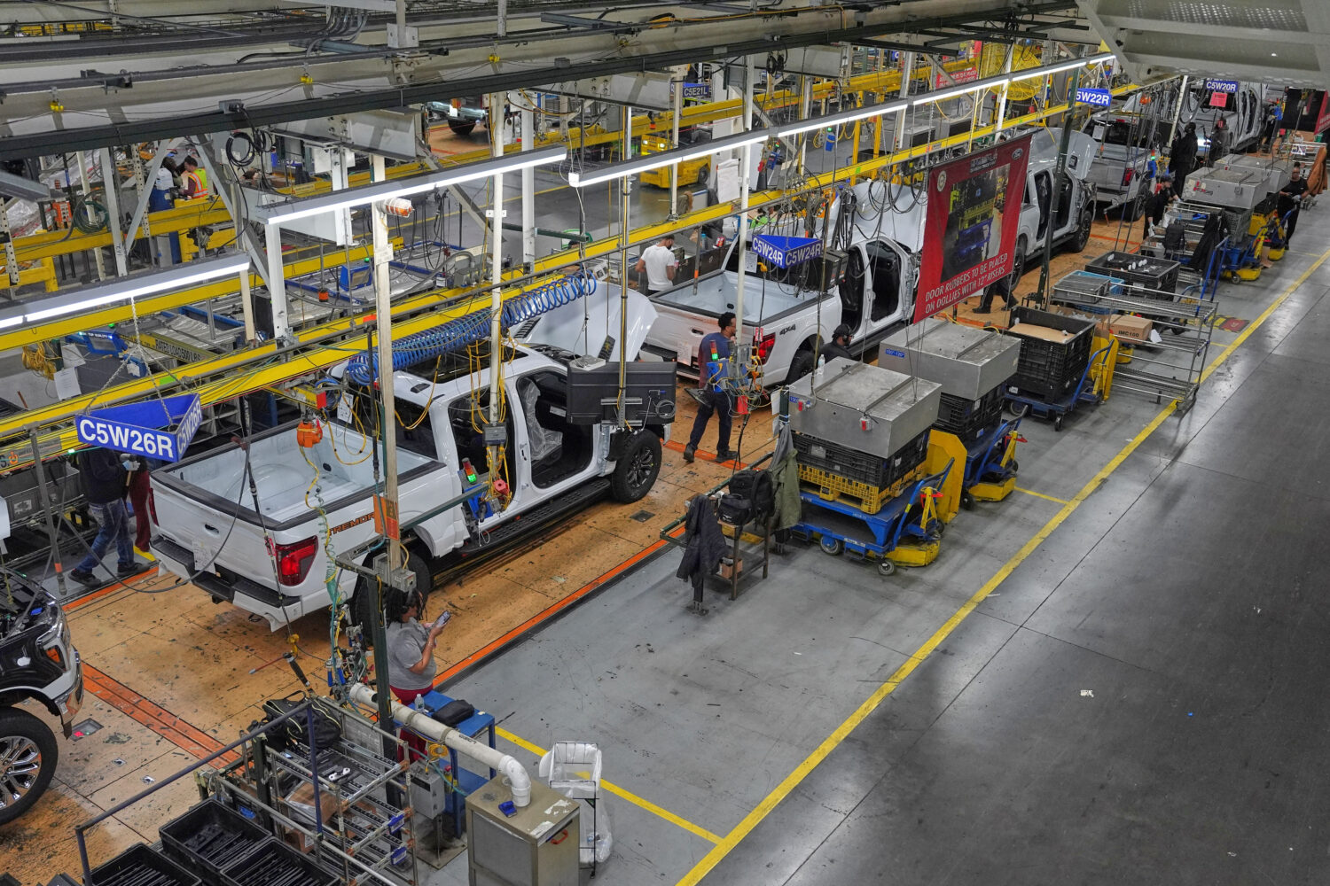 Employees work on the assembly line at the Ford River Rogue complex, Tuesday, Jan. 13, 2026, in Dea...