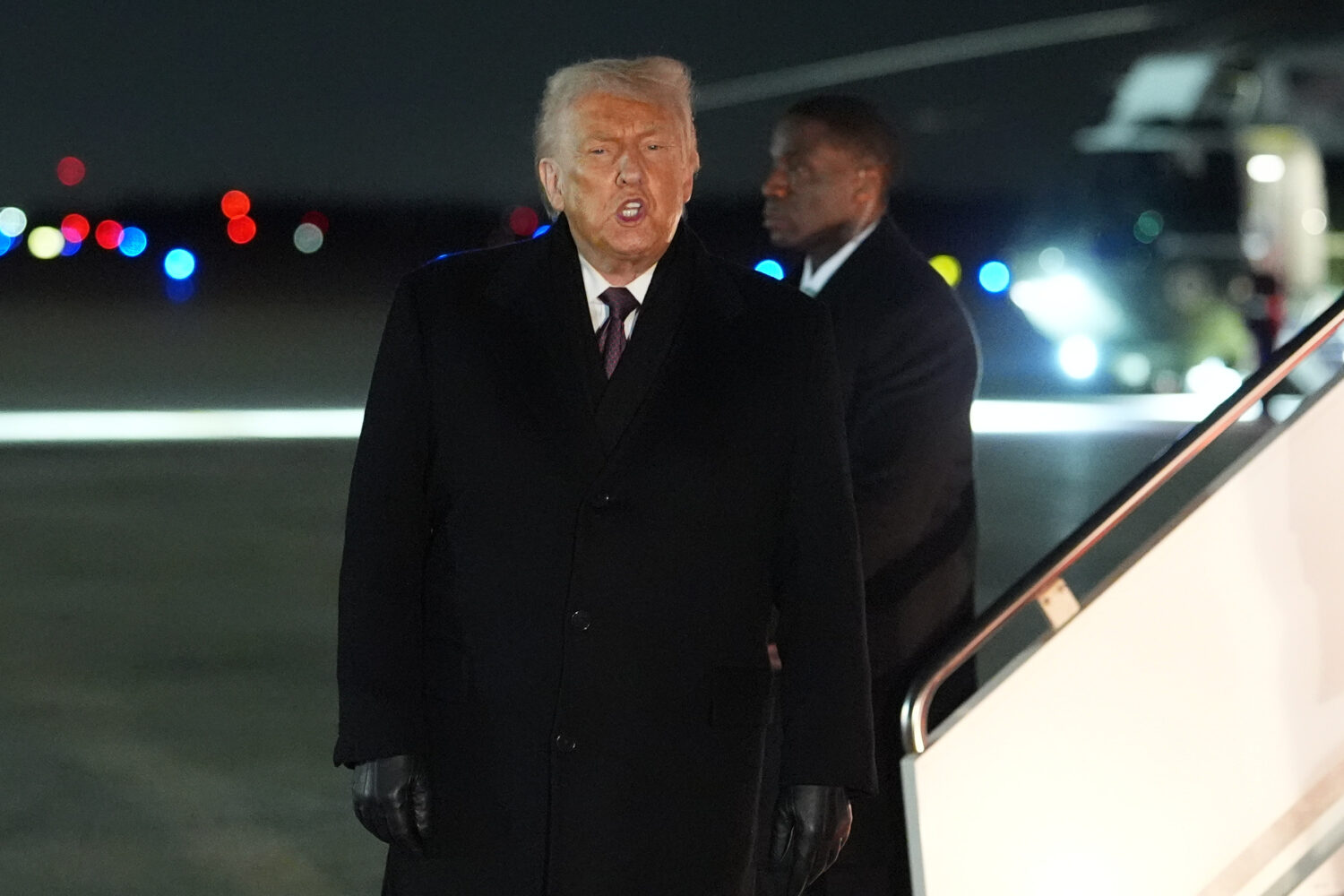 President Donald Trump arrives at Joint Base Andrews, Md., after attending the World Economic Forum...
