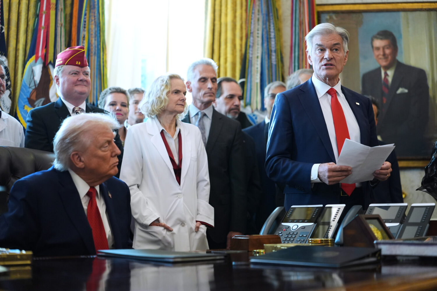 President Donald Trump listens as Centers for Medicare & Medicaid Services administrator Dr. Mehmet...