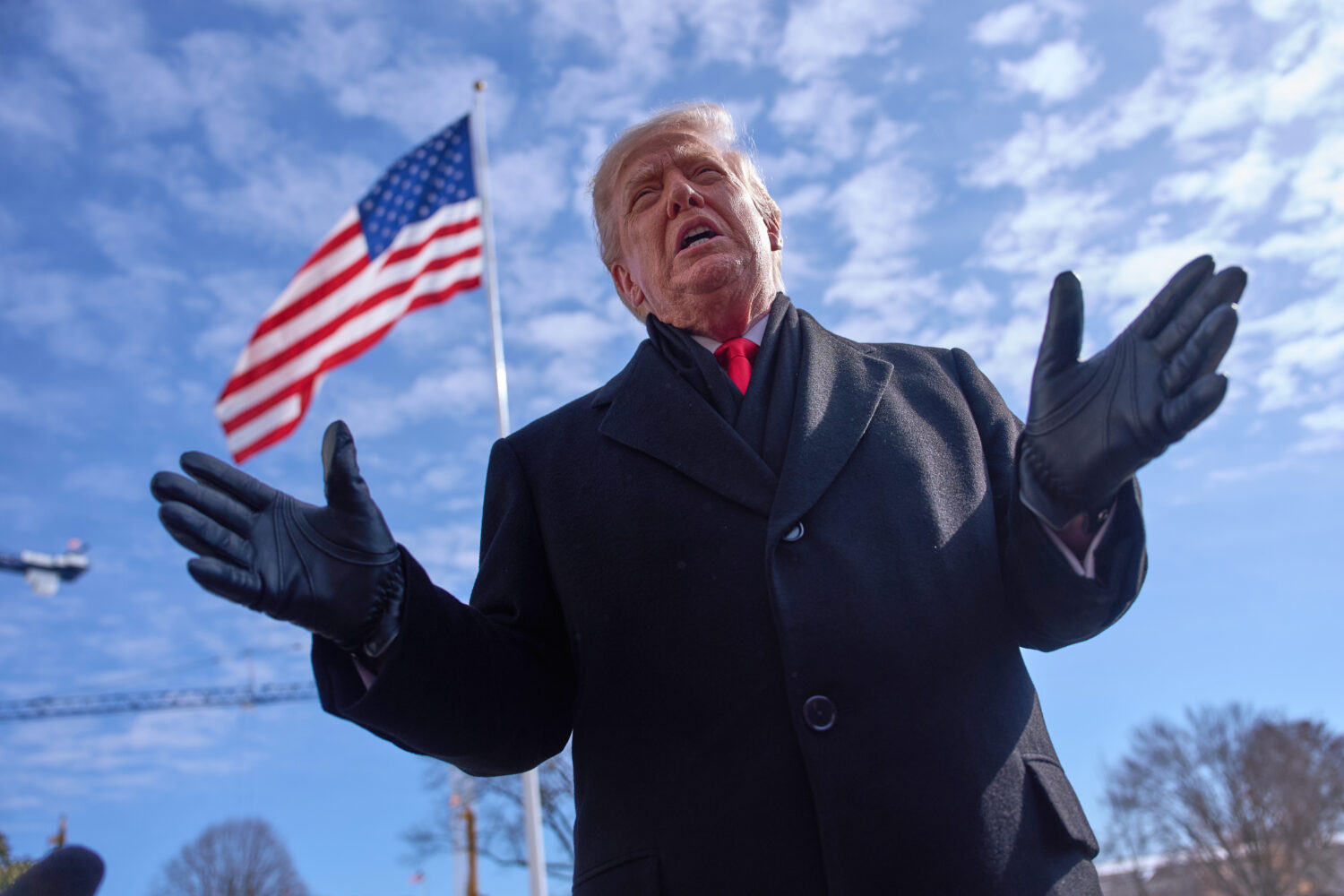 President Donald Trump speaks with reporters before boarding Marine One on South Lawn of the White ...