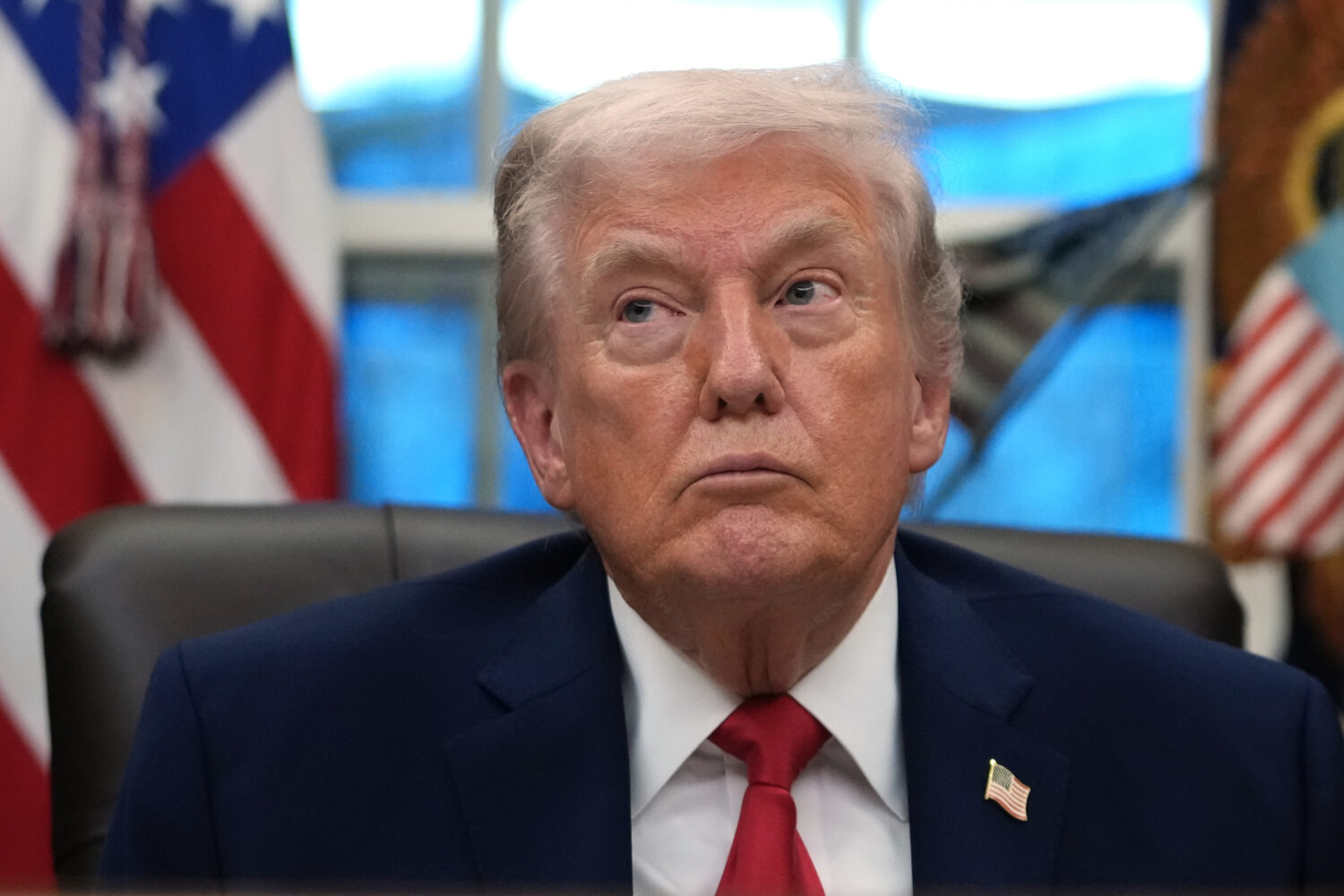 President Donald Trump listens during an event on addiction recovery in the Oval Office of the Whit...