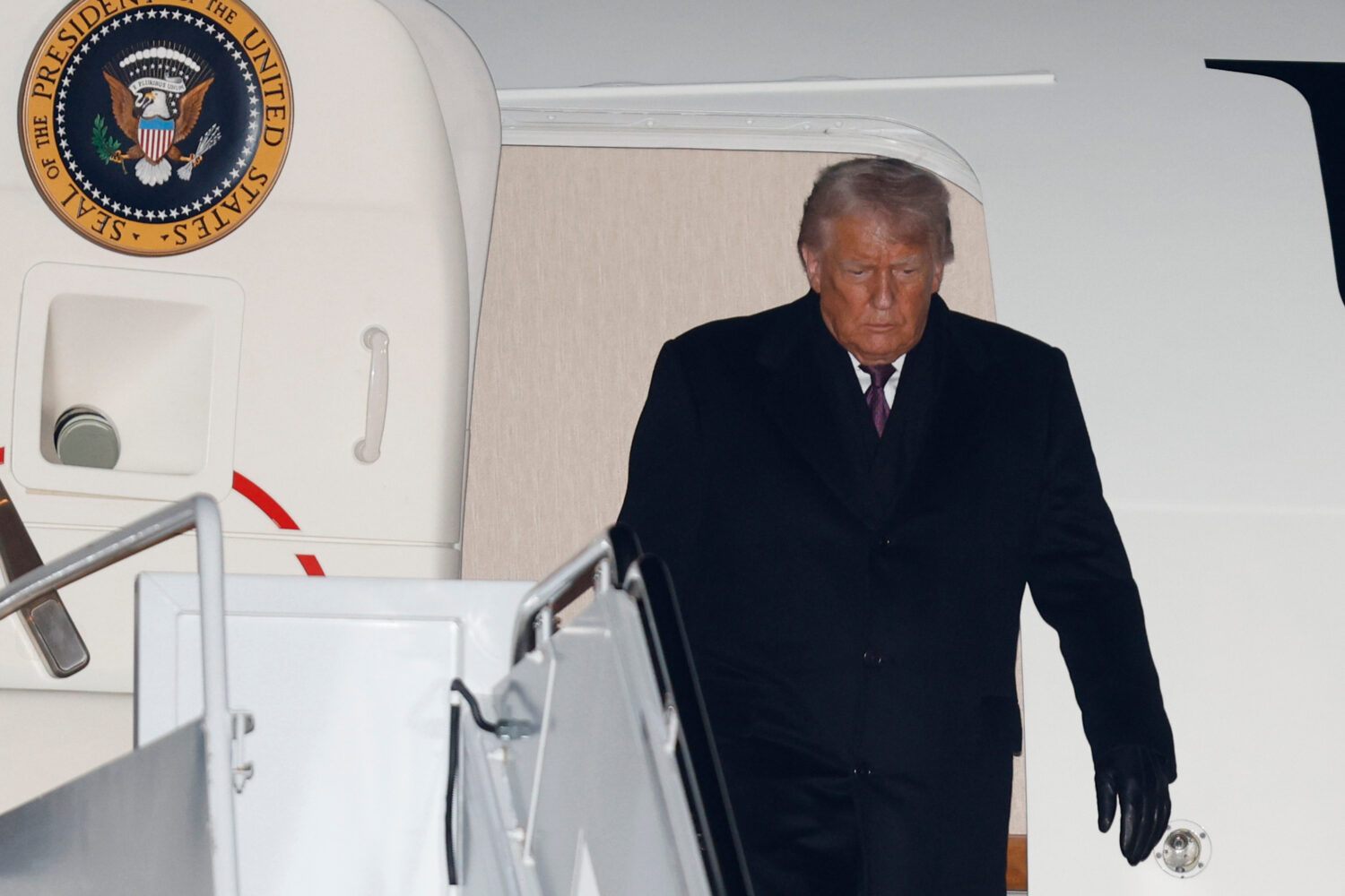 President Donald Trump arrives on Air Force One at Joint Base Andrews, Md., Thursday, Jan. 22, 2026...