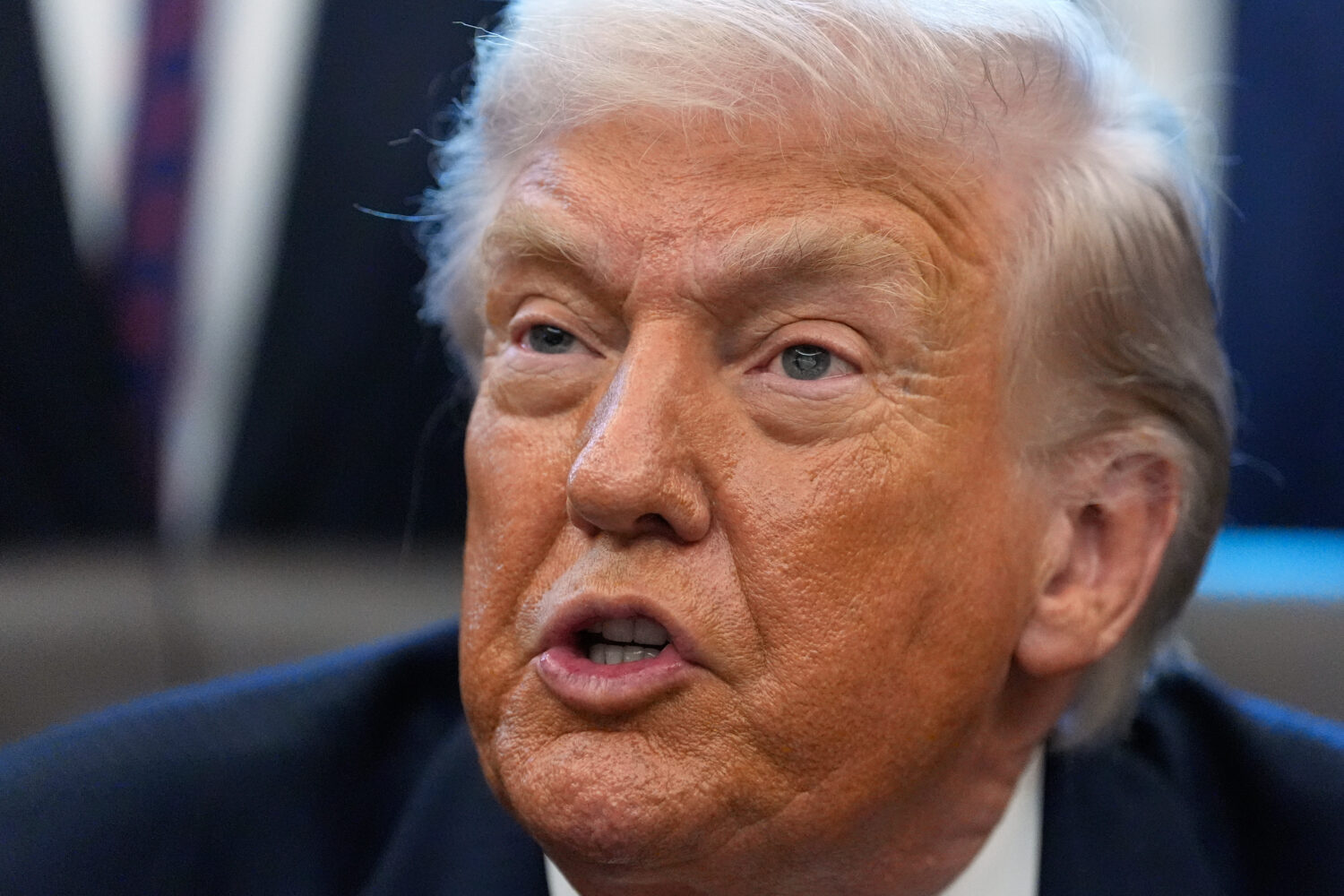President Donald Trump answers questions after signing a bill that returns whole milk to school caf...