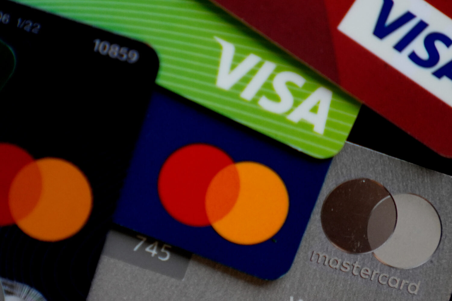 FILE - Visa and Mastercard credit cards are shown in Buffalo Grove, Ill., Feb. 8, 2024. (AP Photo/N...