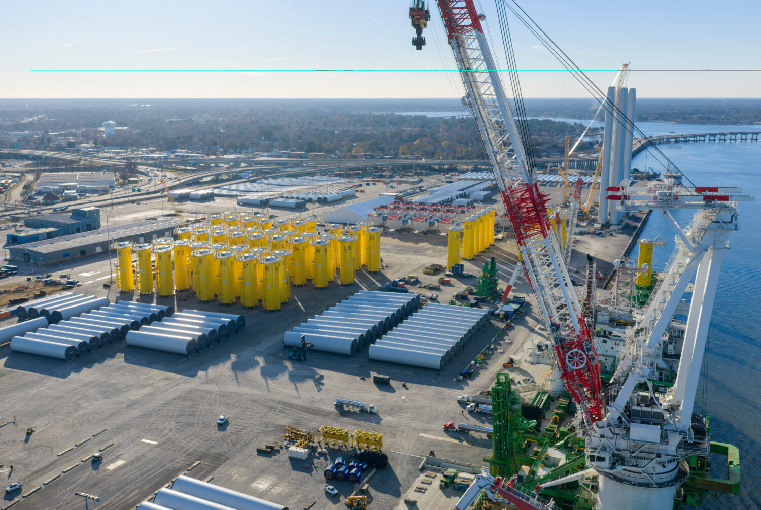 FILE - Wind turbine bases, generators and blades sit along with support ships at The Portsmouth Mar...