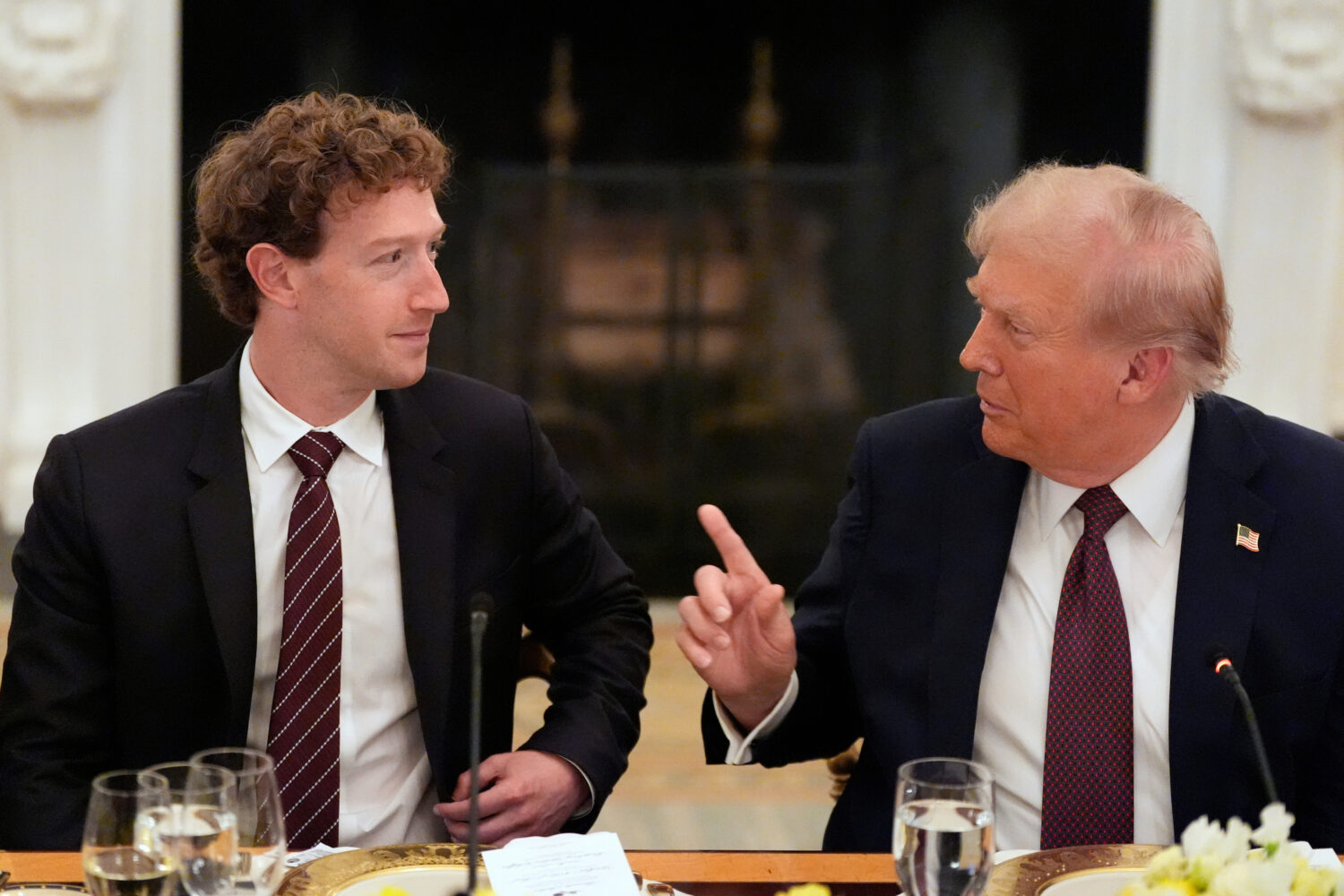 FILE - President Donald Trump speaks to Facebook CEO Mark Zuckerberg during a dinner in the State D...