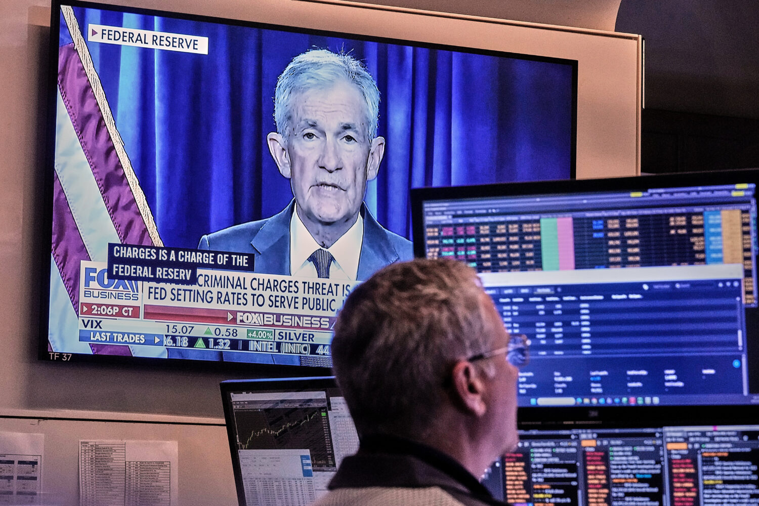 A video of Federal Reserve Chair Jerome Powell plays on a screen on the floor of the New York Stock...