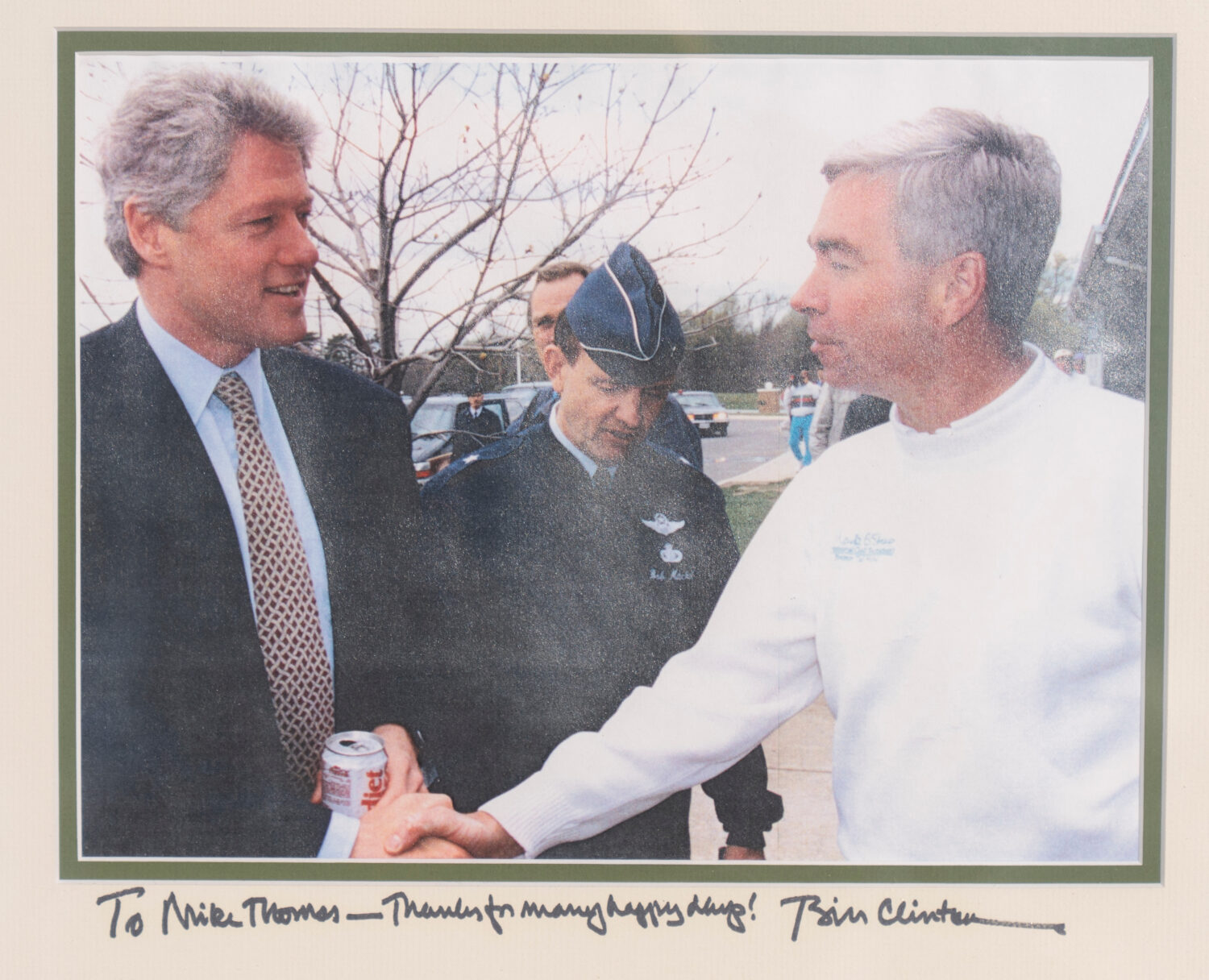 An inscribed photo of President Bill Clinton with Michael Thomas, the former manager of the Courses...