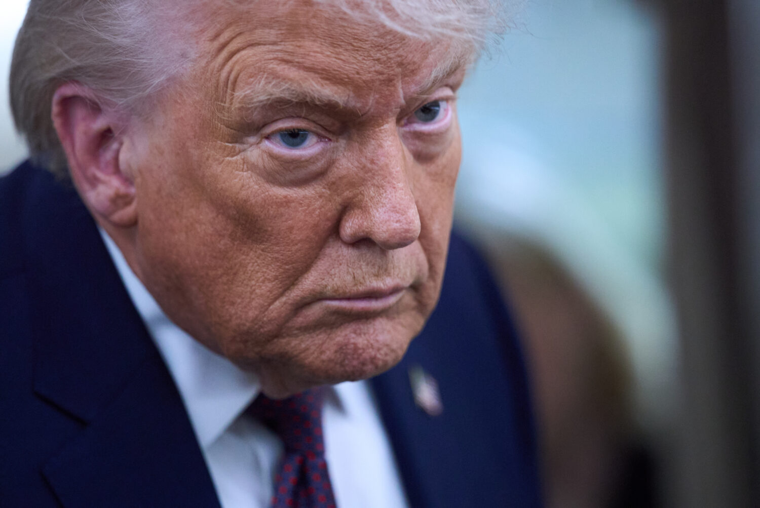 President Donald Trump speaks with reporters aboard Air Force One after leaving the World Economic ...