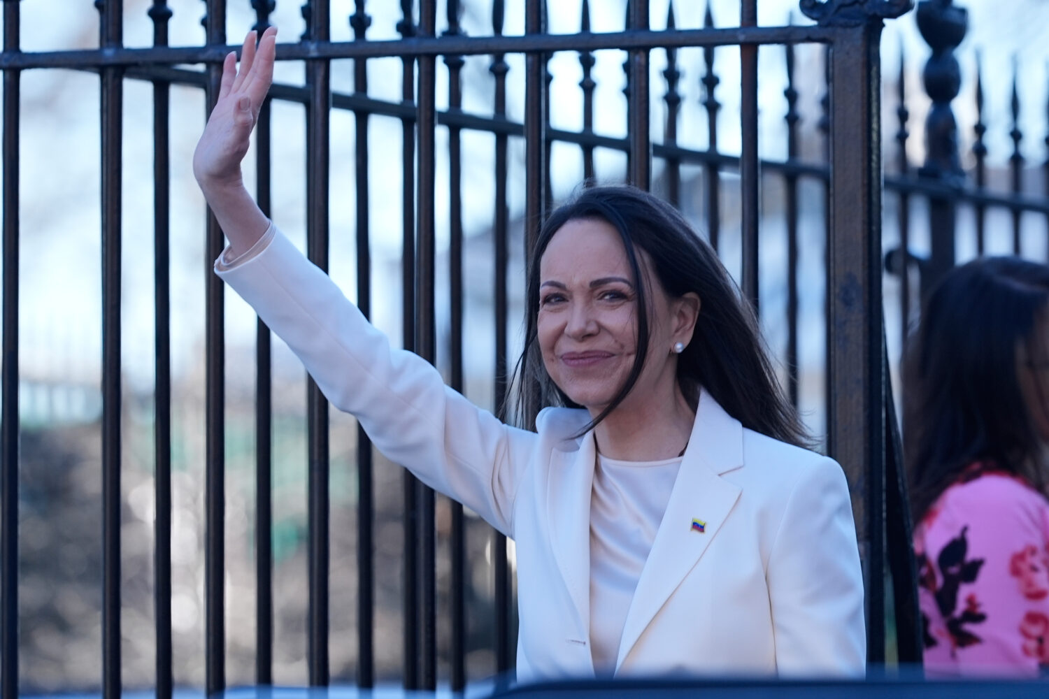 Venezuelan opposition leader María Corina Machado waves to supporters on Pennsylvania Avenue as sh...