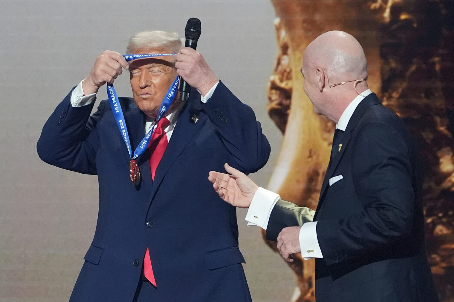 FILE - President Donald Trump is presented with the inaugural FIFA Peace Prize by FIFA President Gi...