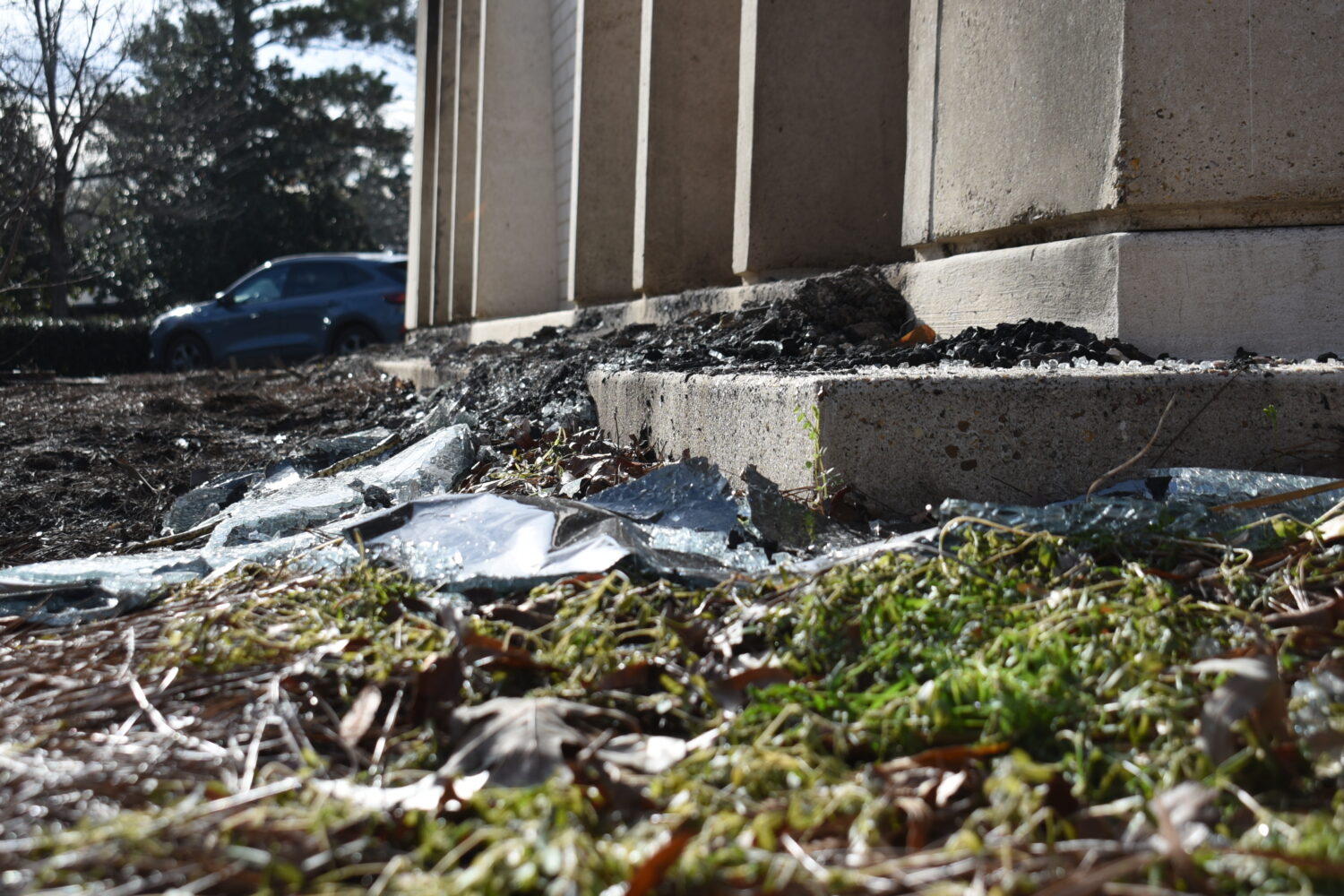 Burnt debris from a fire at the Beth Israel Congregation glint in the sun on Monday, Jan. 12, 2026,...