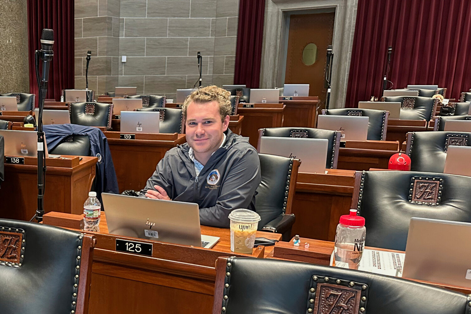FILE - Missouri state Rep. Jeremy Dean, D-Springfield, glances up from his computer in the Missouri...