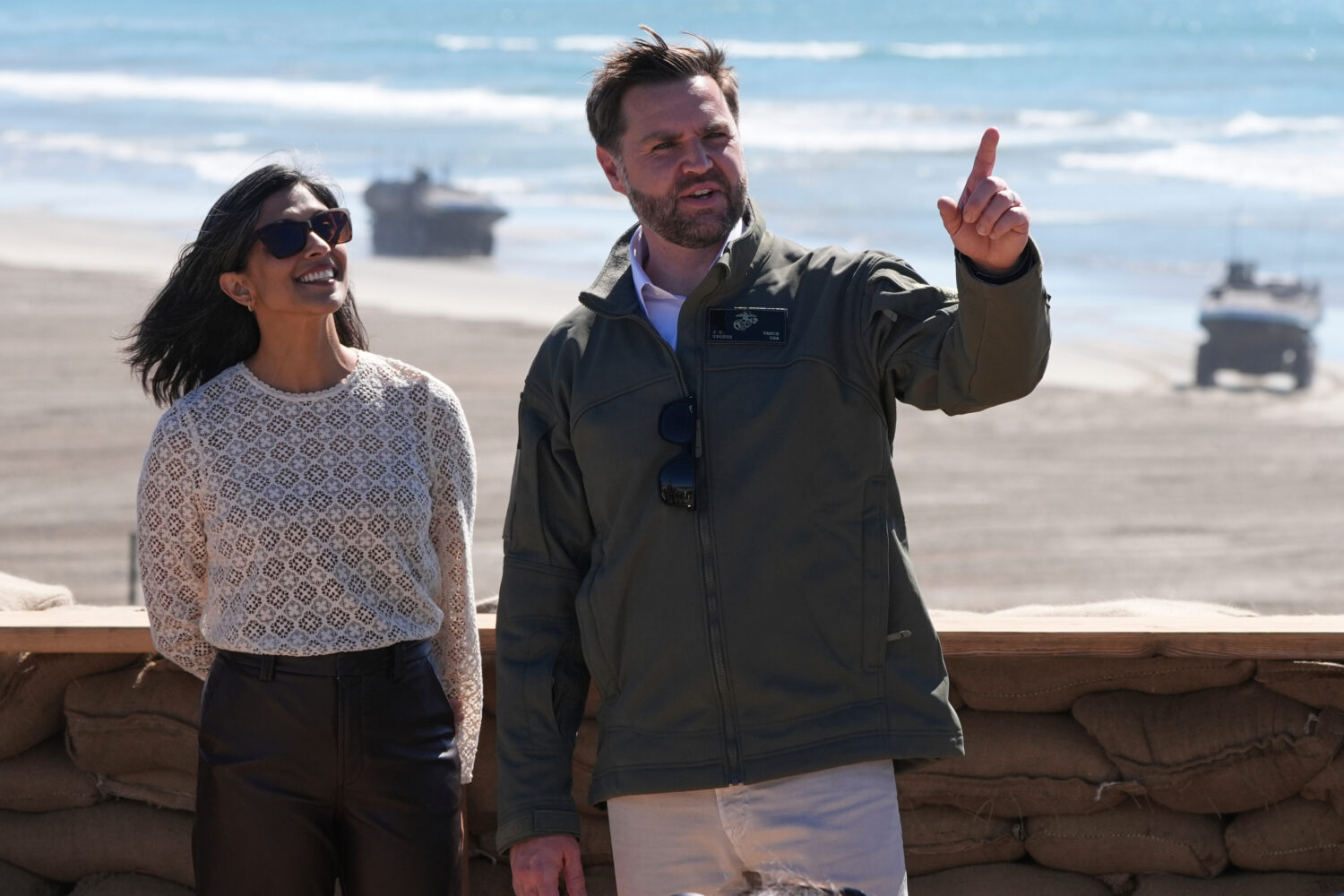 FILE - Vice President JD Vance, right, and second lady Usha Vance watch a demonstration by Marines ...