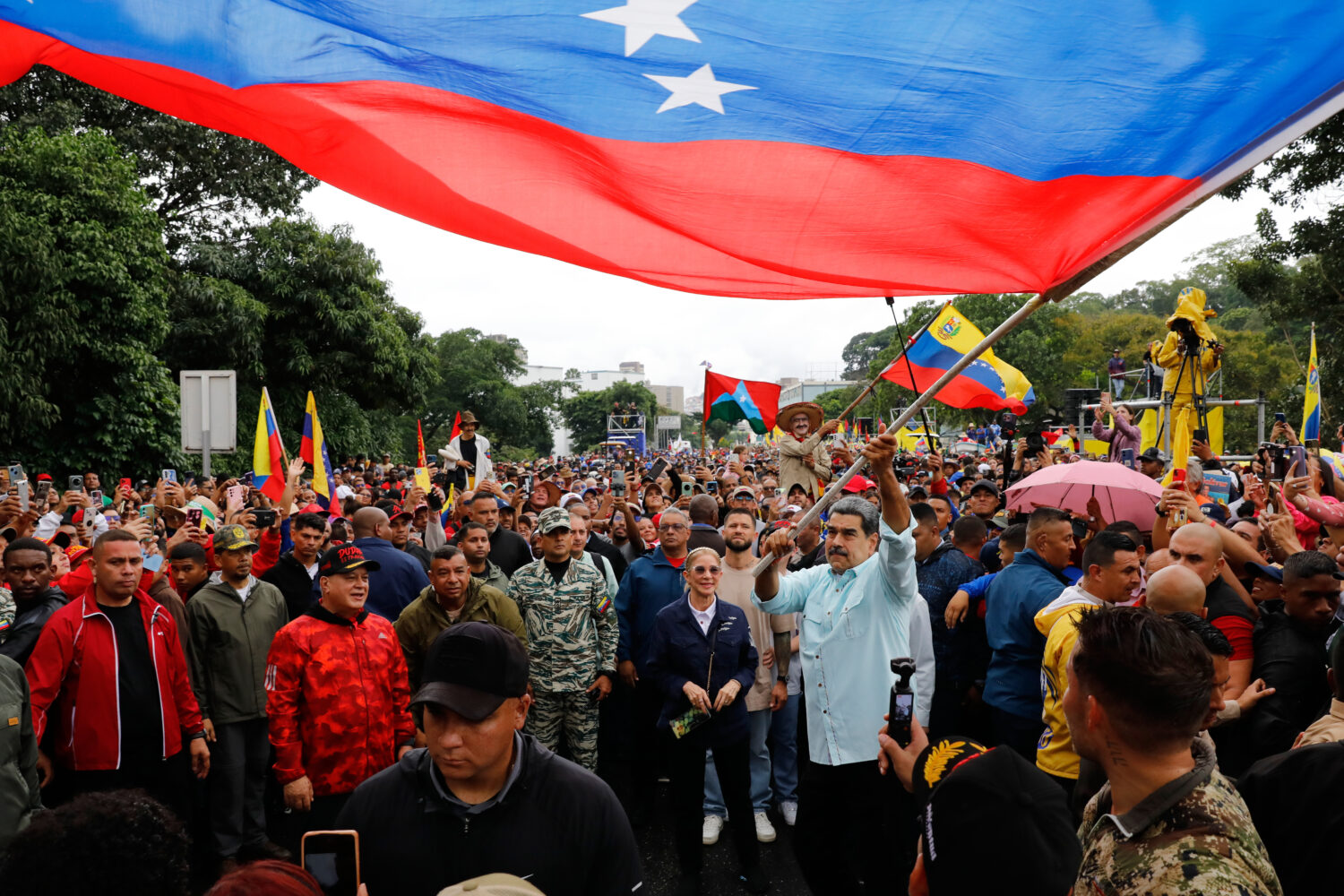 President Nicolas Maduro waves a flag during a rally marking the anniversary of the Battle of Santa...