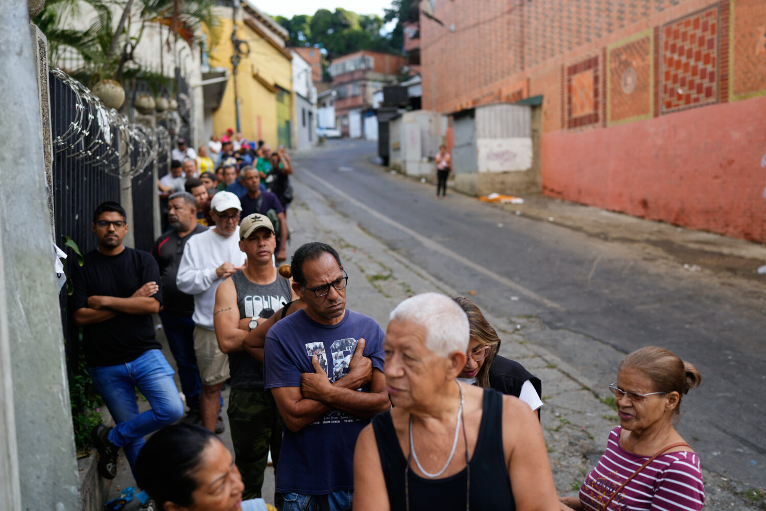 Shoppers line up at a supermarket in Caracas, Venezuela, Sunday, Jan. 4, 2026. (AP Photo/Ariana Cub...