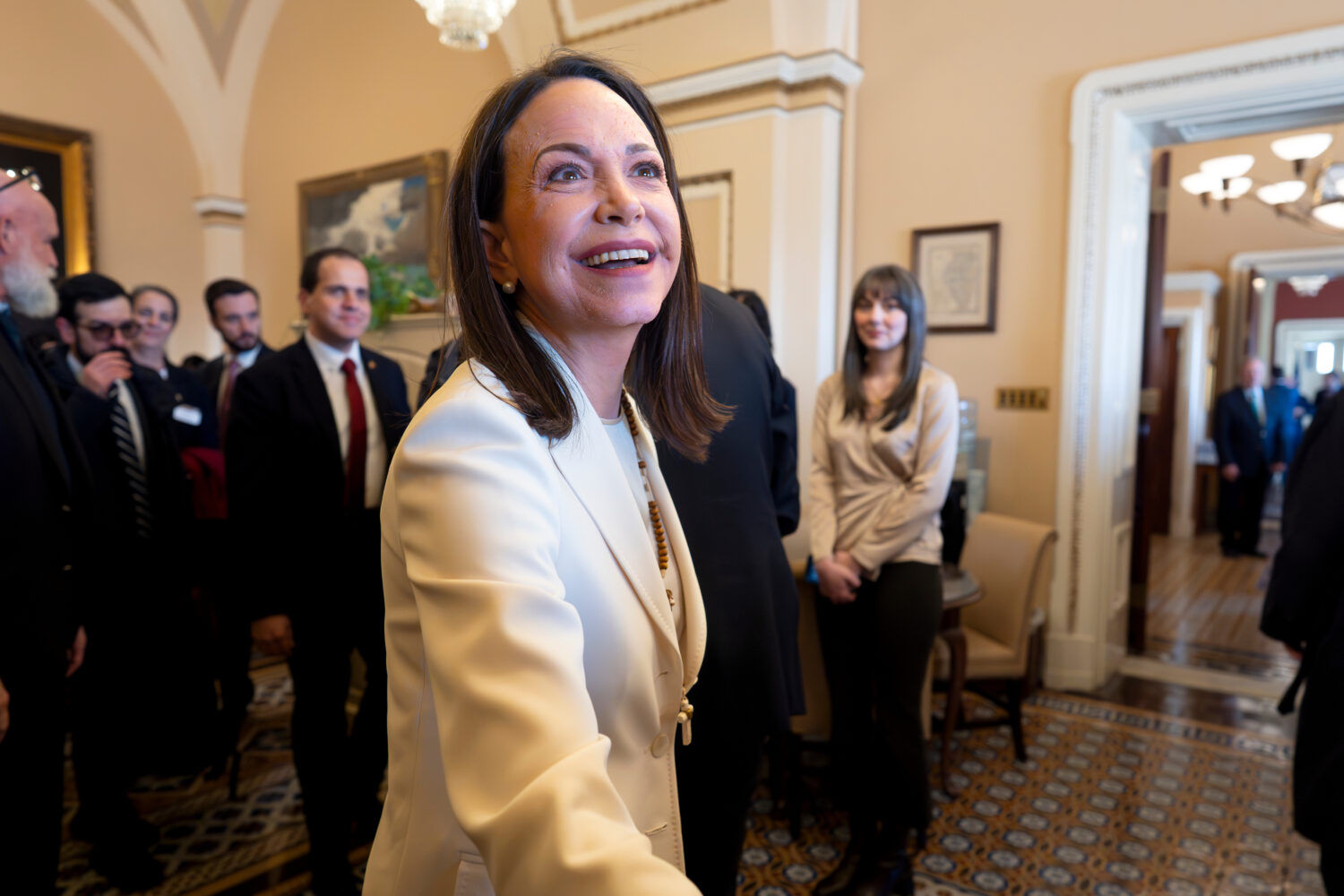 Venezuelan opposition leader Maria Corina Machado is welcomed as she arrives for meetings in the of...