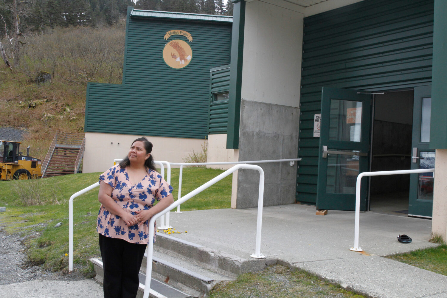 FILE - Tupe Smith poses for a photo outside the school in Whittier, Alaska, May 13, 2025. (AP Photo...