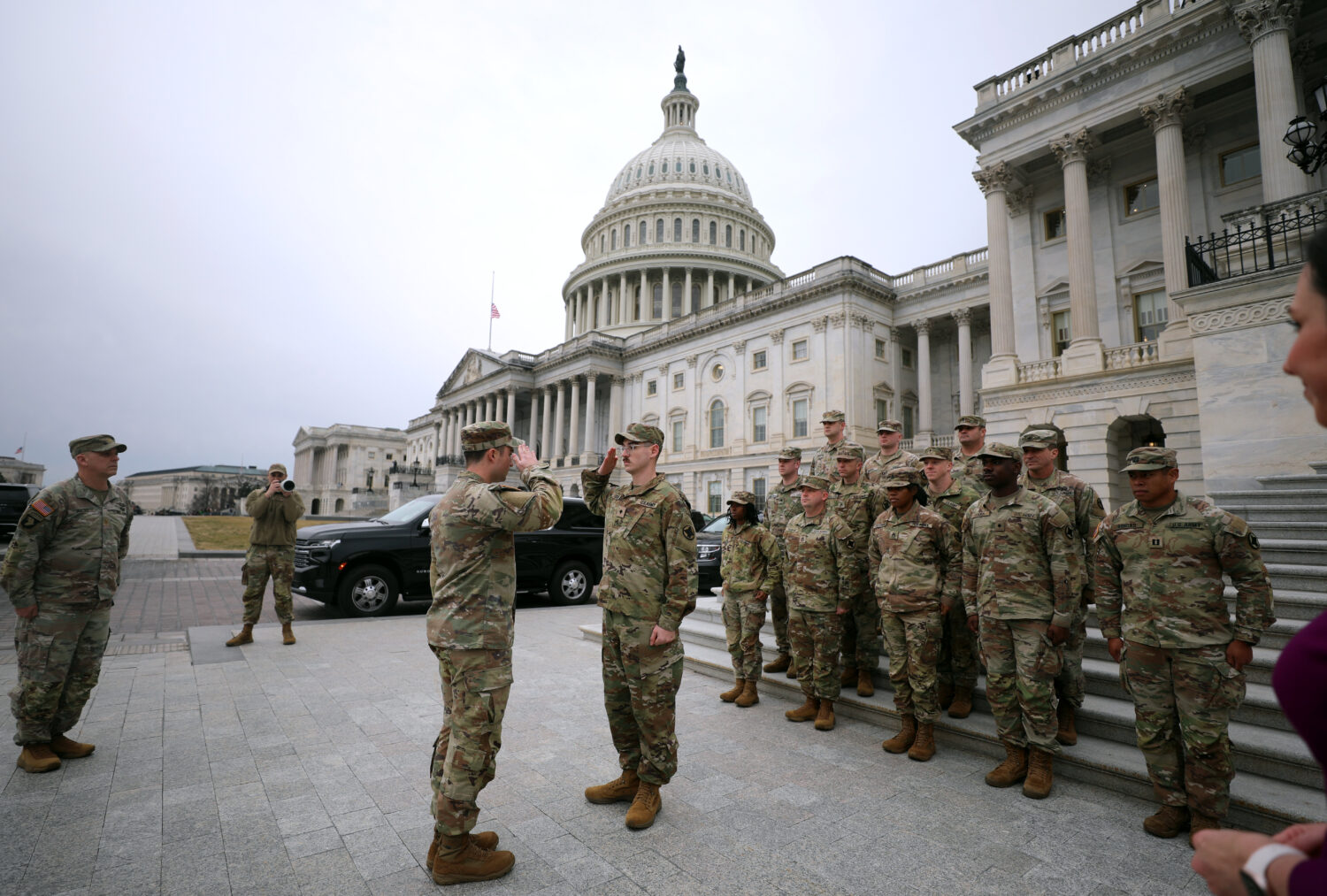 National Guard are seen on the East Front of the U.S. Capitol, Wednesday, Jan. 14, 2026, in Washing...