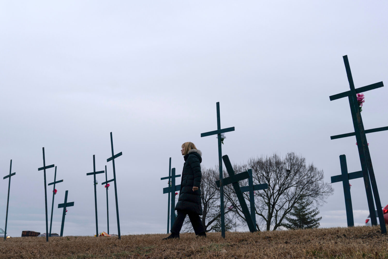 FILE - Crosses are seen at a makeshift memorial for the victims of the plane crash in the Potomac R...