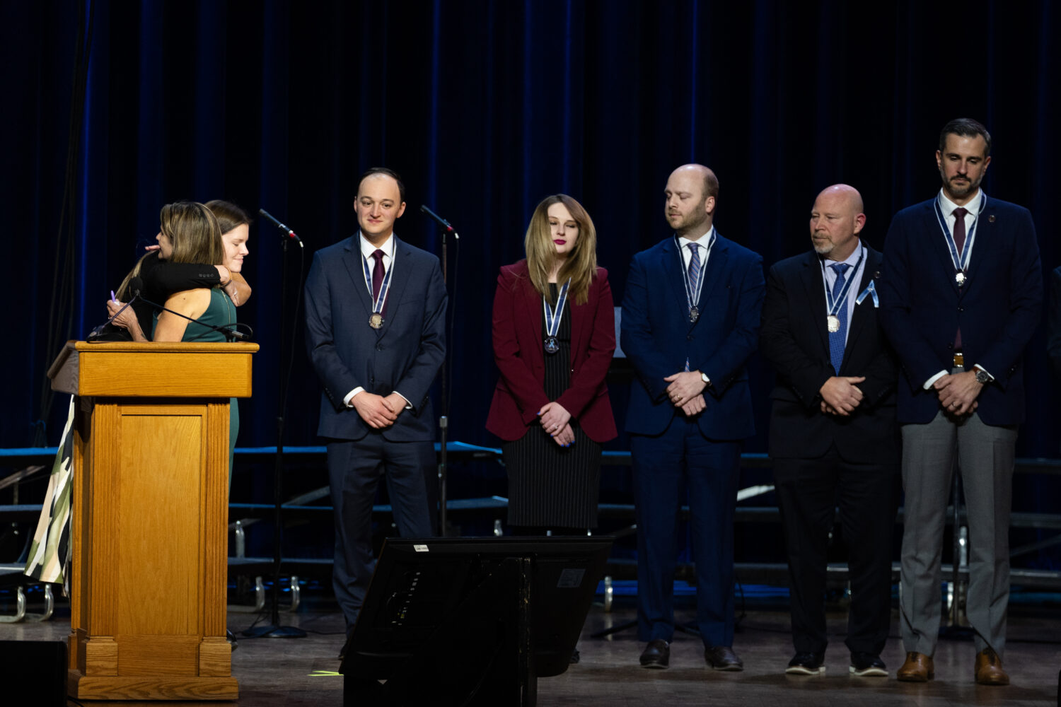 First responders accept medals at an event honoring the 67 lives lost in the 2025 midair collision ...