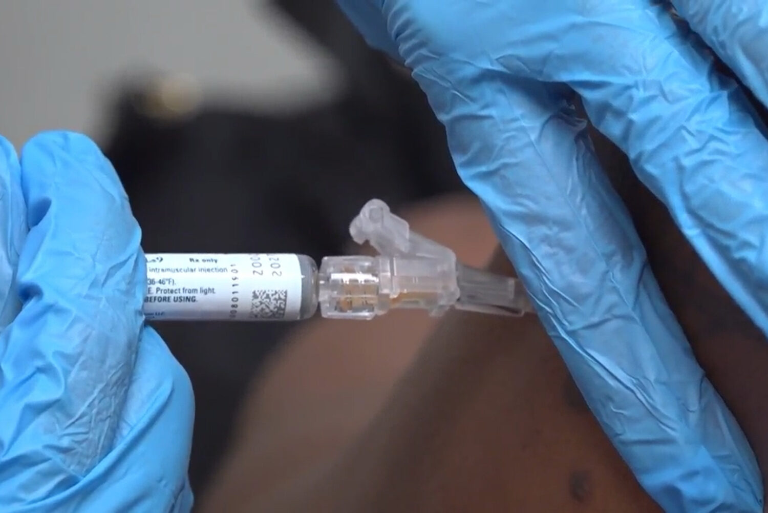 FILE - A pharmacist gives a patient a flu shot in Miami on Sept. 9, 2025. (AP Photo/Daniel Kozin, F...