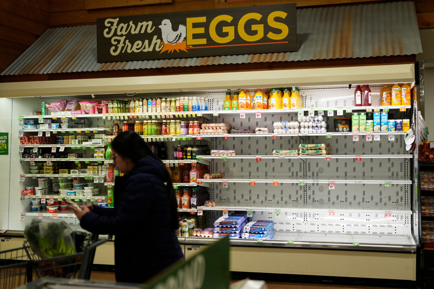 A shopper buys groceries Wednesday, Jan. 21, 2026, in Nashville, Tenn., ahead of a winter storm exp...