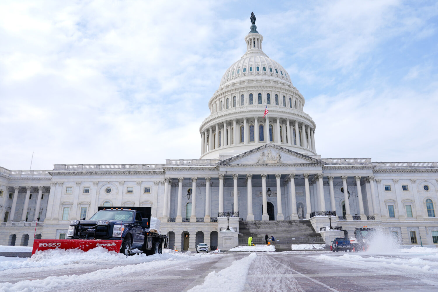 Workers clear the Capitol grounds after a snowstorm Monday, Jan. 26, 2026, in Washington. (AP Photo...