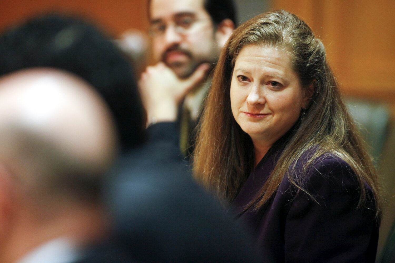 FILE - Assistant Attorney General Maria Lazar glances at Dane County District Attorney Ismael Ozann...