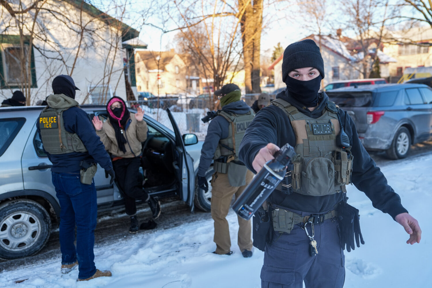 Activists are approached by federal agents for following agent vehicles, on Tuesday, Feb. 3, 2026, ...