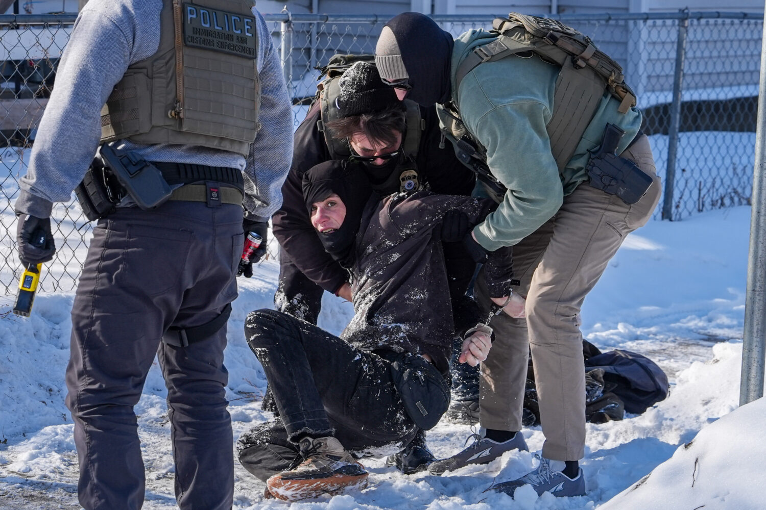 An person is detained by federal agents on Tuesday, Feb. 3, 2026, in Minneapolis. (AP Photo/Ryan Mu...