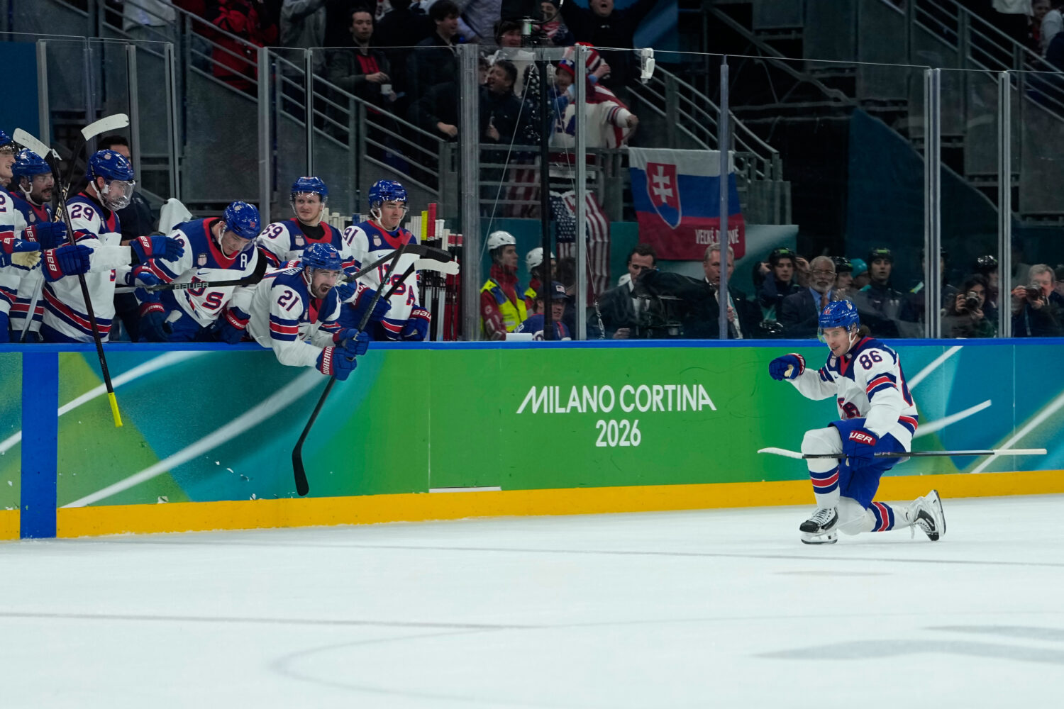 United States' Jack Hughes (86) celebrates after scoring his side's third goal during a men's ice h...