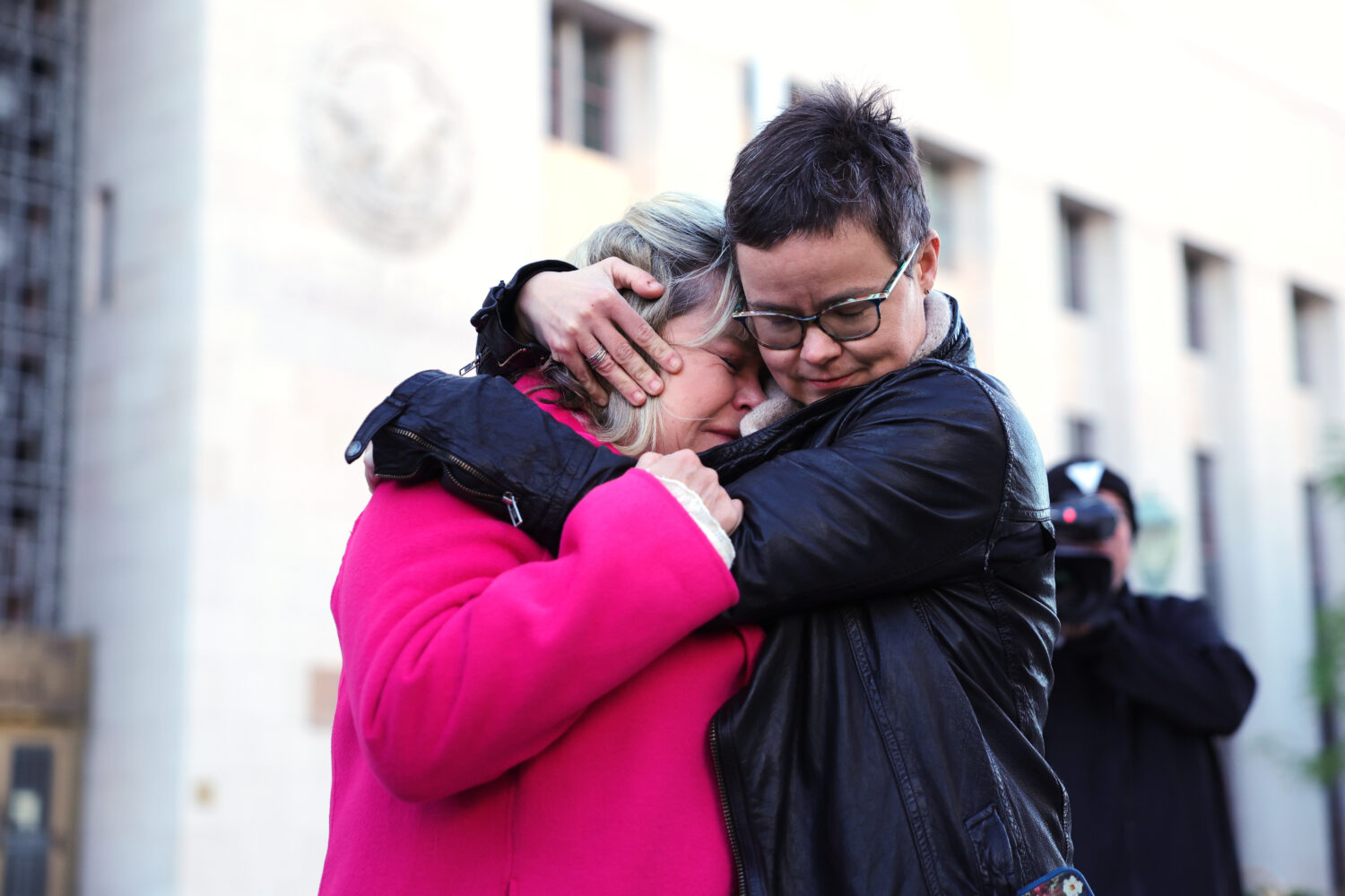 Lennon Flowers, right, Project Director of The Parents' Network hugs Lori Schott, mother of Annalee...