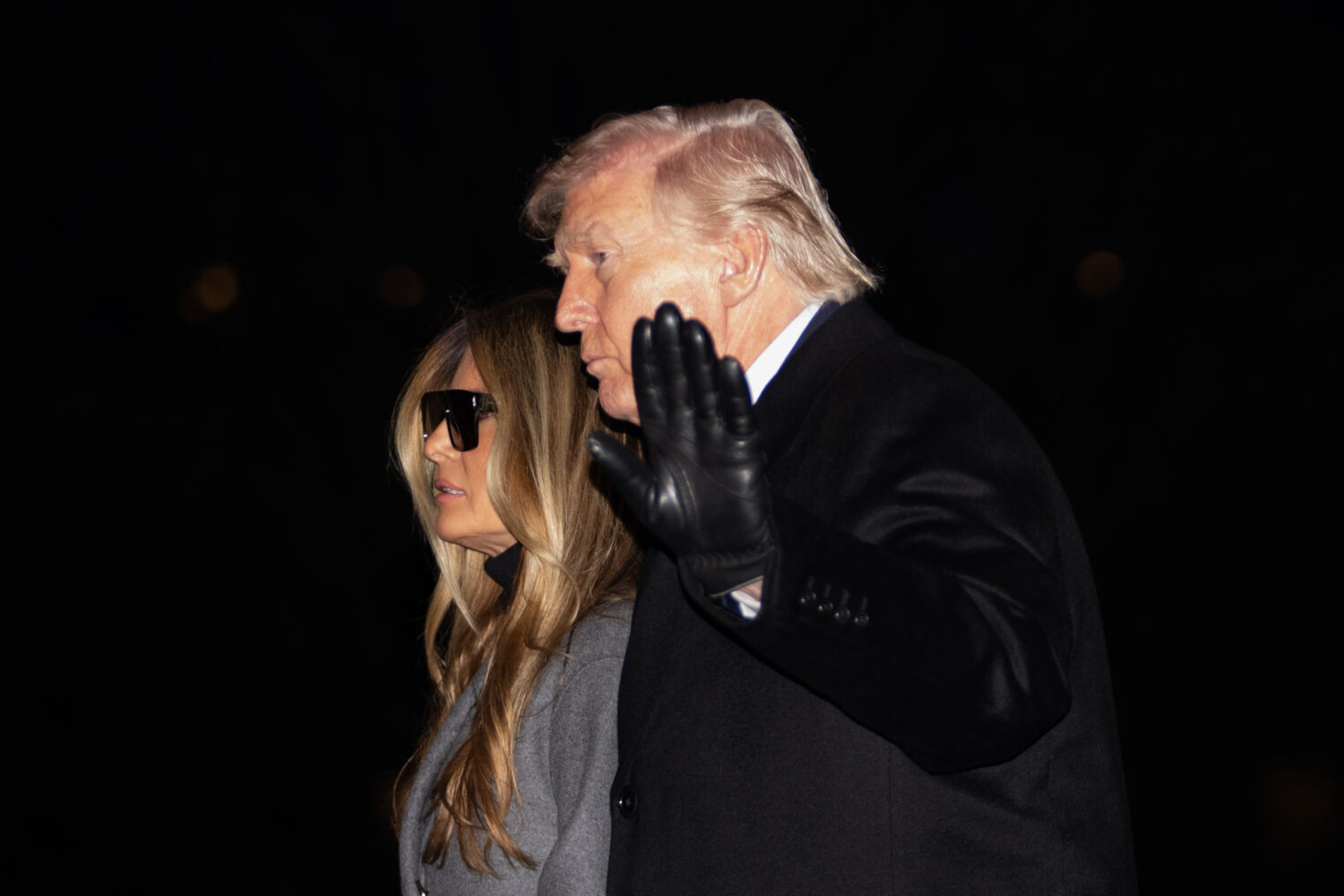 President Donald Trump and first lady Melania Trump walk on the South Lawn to the White House after...