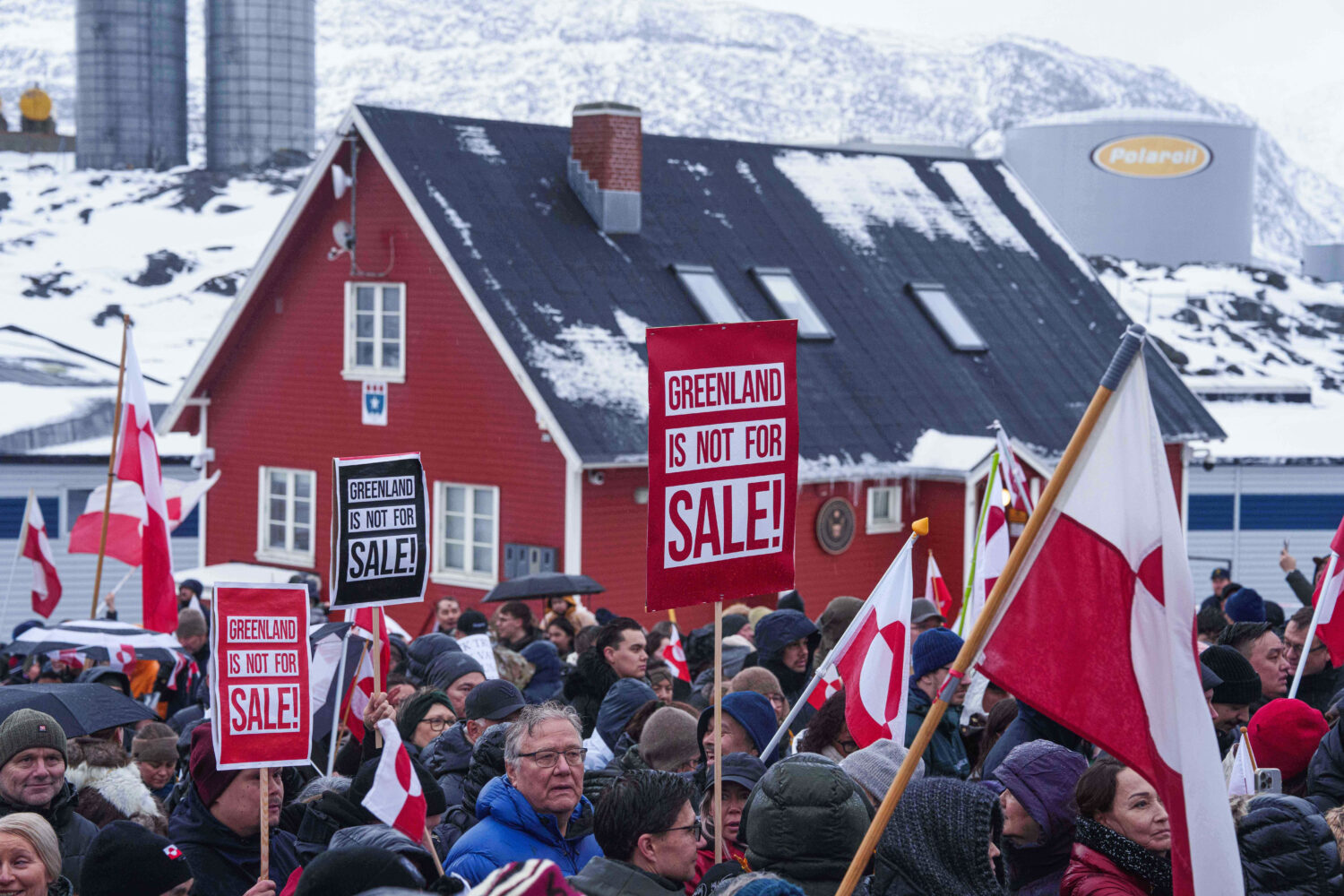 FILE - People protest against President Donald Trump's policy towards Greenland in front of U..S co...