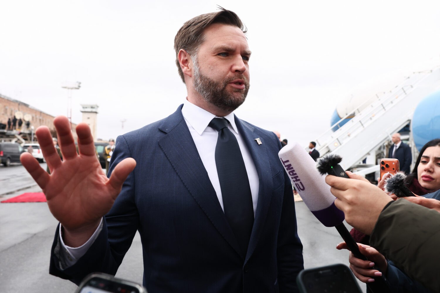 U.S. Vice President J.D. Vance speaks to the media before boarding Air Force Two upon departure for...