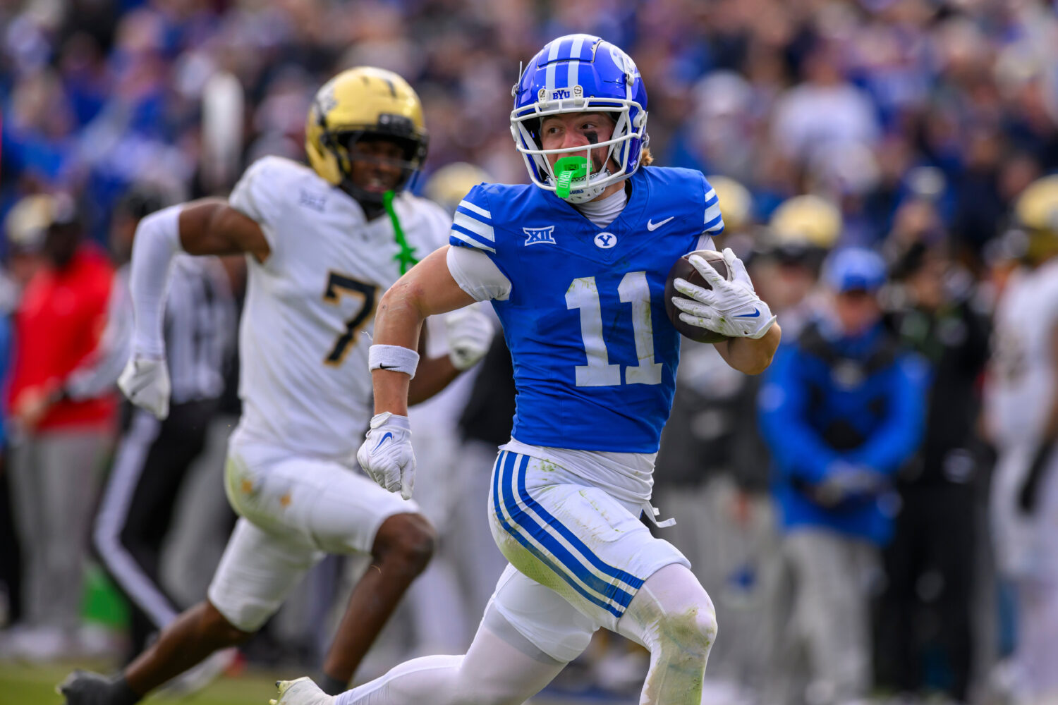 FILE - BYU wide receiver Parker Kingston (11) runs the ball in for a touchdown during the second ha...