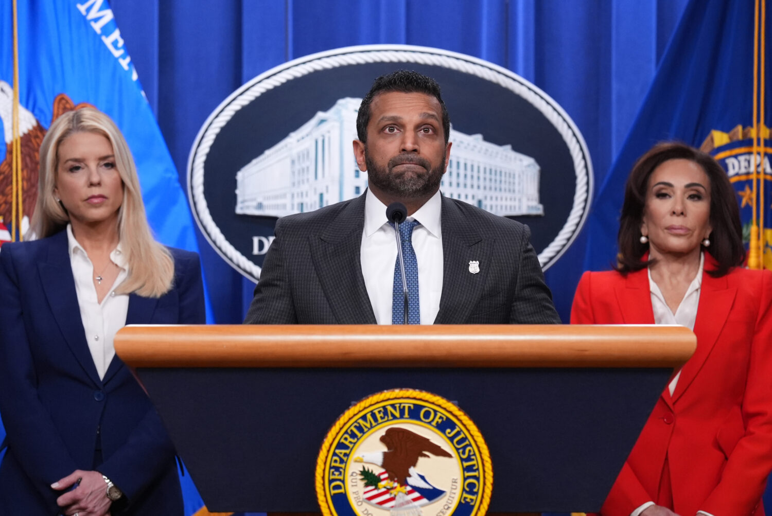 FBI Director Kash Patel, flanked by Attorney General Pam Bondi, left, and Jeanine Pirro, U.S. Attor...