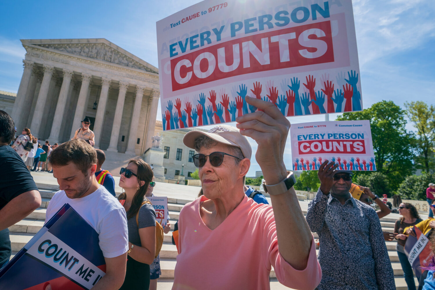 FILE - Immigration activists rally outside the Supreme Court as the justices hear arguments over th...