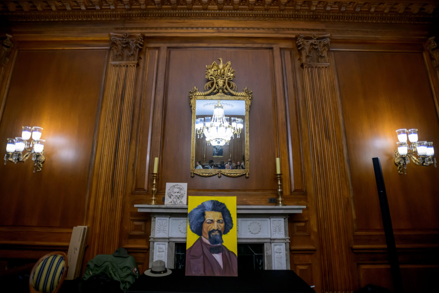 Artwork portraying Frederick Douglass rests on a table during a formal dedication of the House Pres...