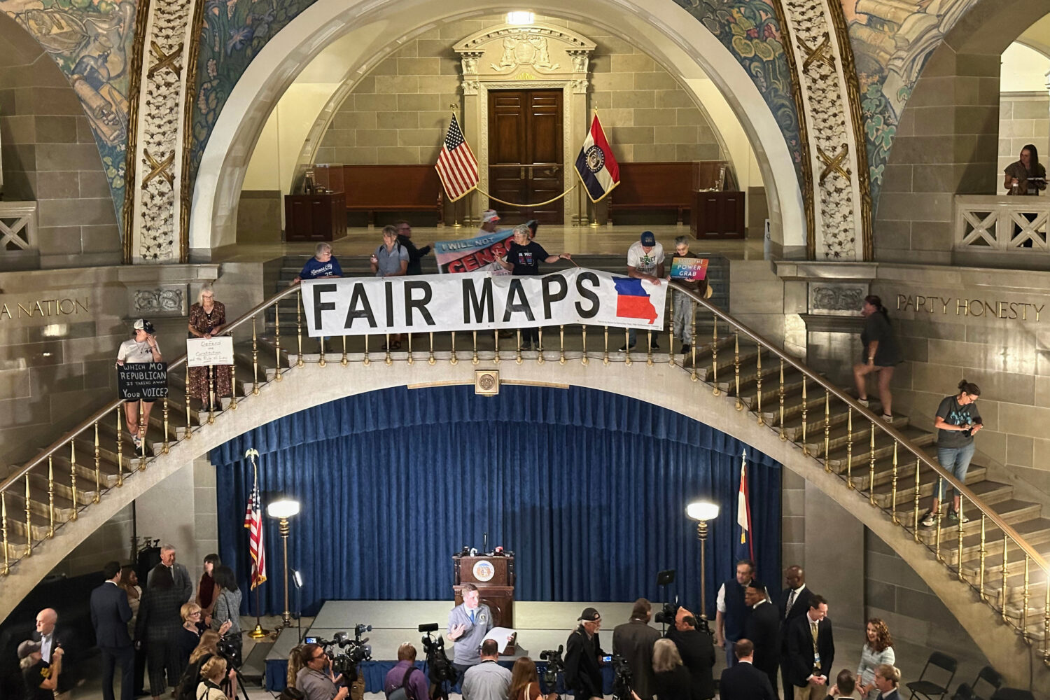 FILE - Opponents of Missouri's Republican-backed congressional redistricting plan display a banner ...