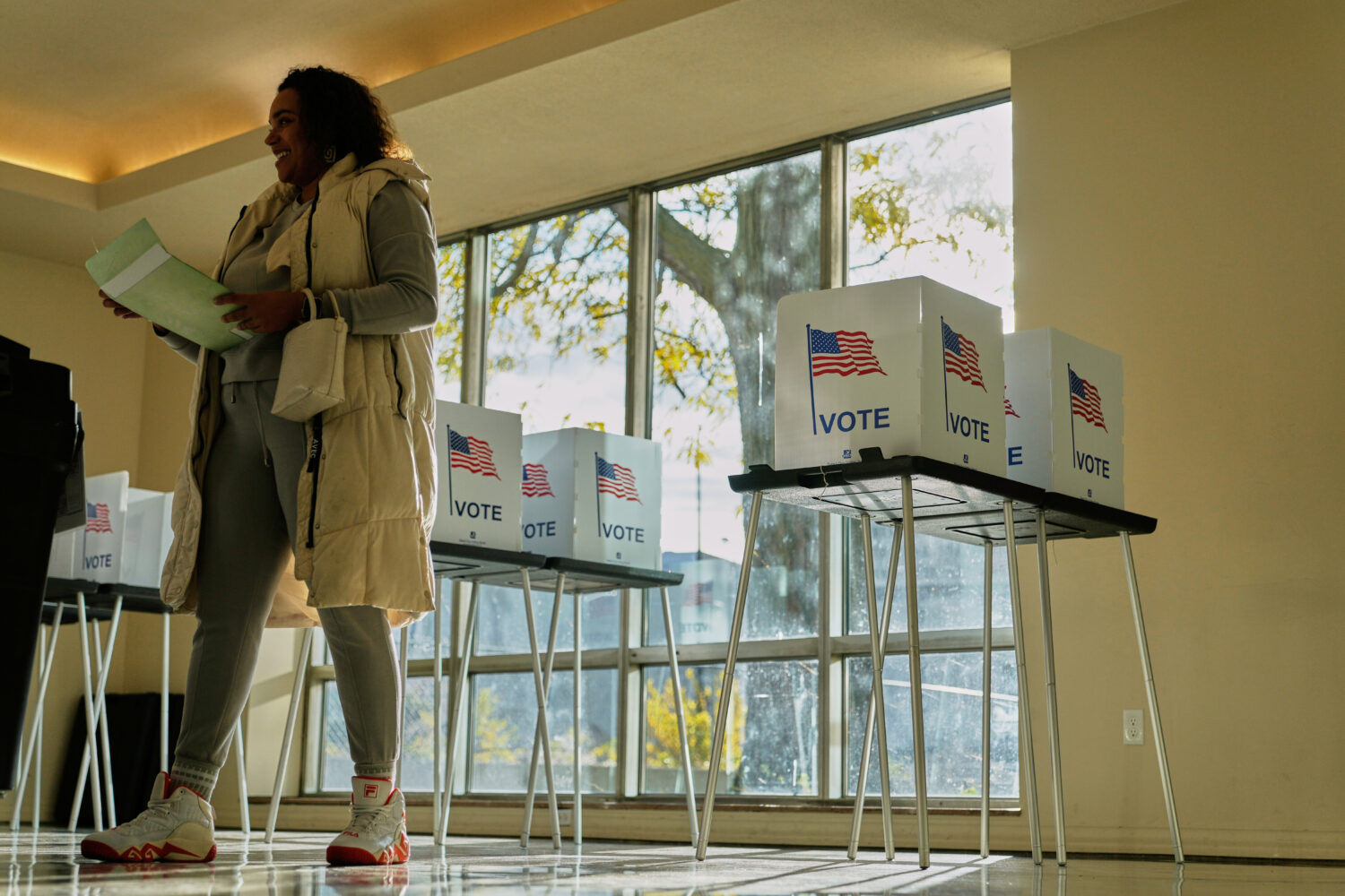 FILE - People wait to cast their ballot at the Horatio Williams Foundation in downtown Detroit, Tue...