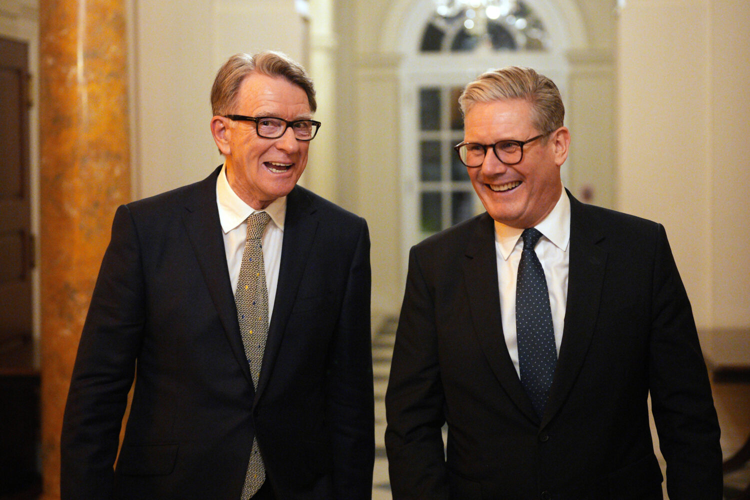 FILE - British Prime Minister Keir Starmer, right, talks with Britain's ambassador to the United St...