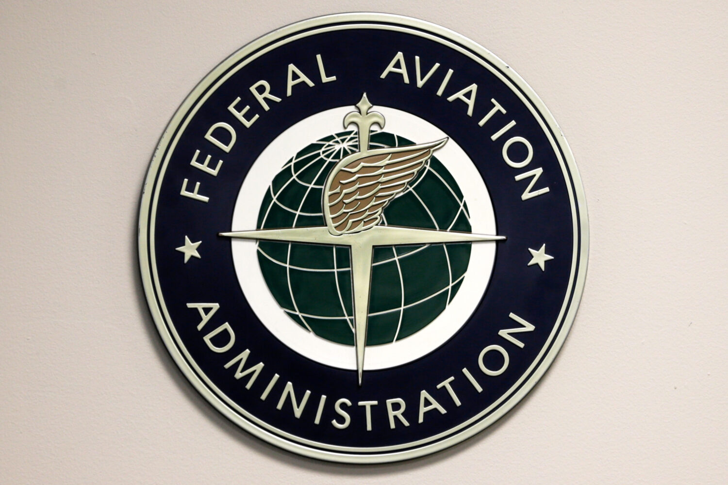FILE - A Federal Aviation Administration sign hangs in the tower at John F. Kennedy International A...