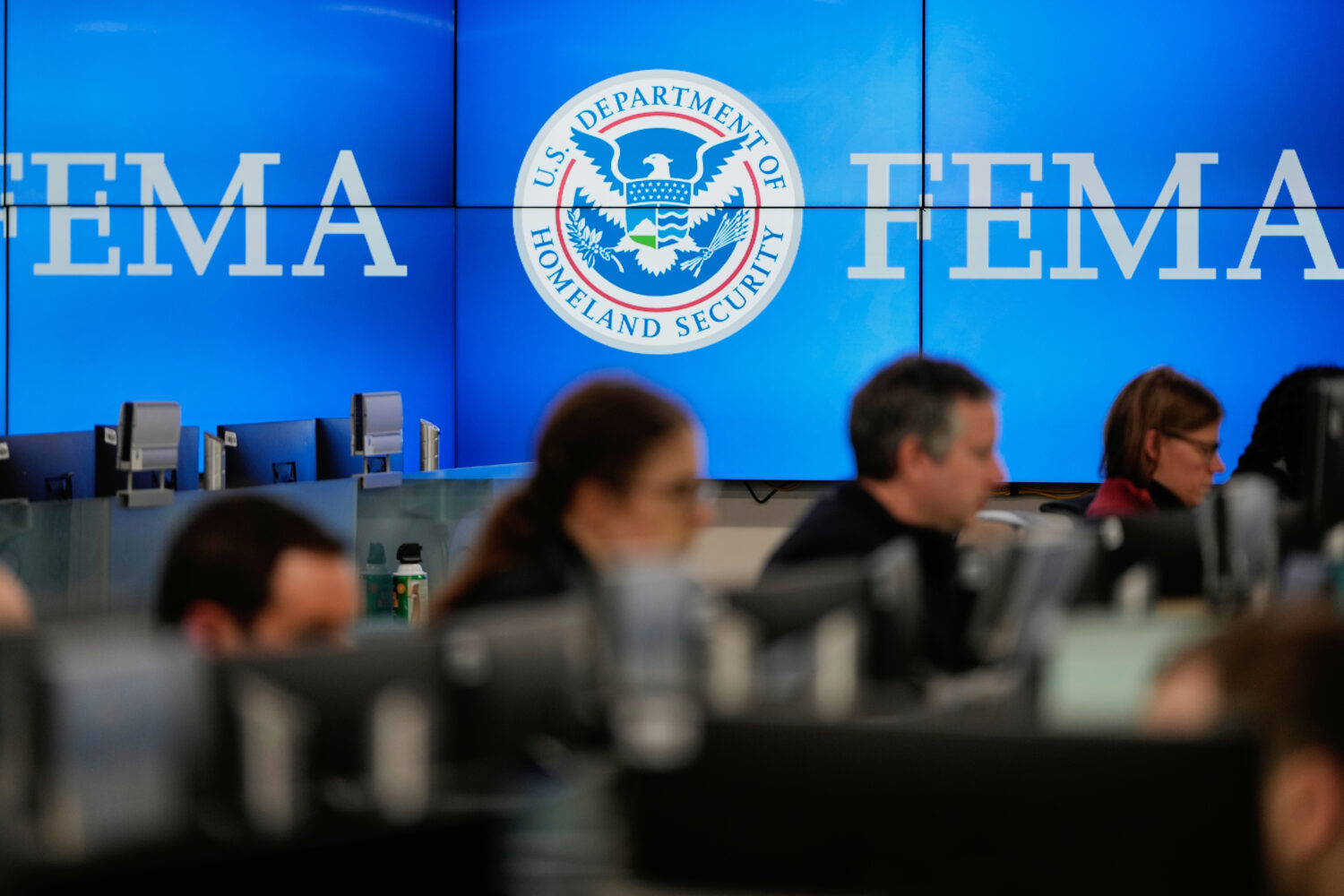 FILE - People work at the Federal Emergency Management Agency headquarters in Washington, on Saturd...