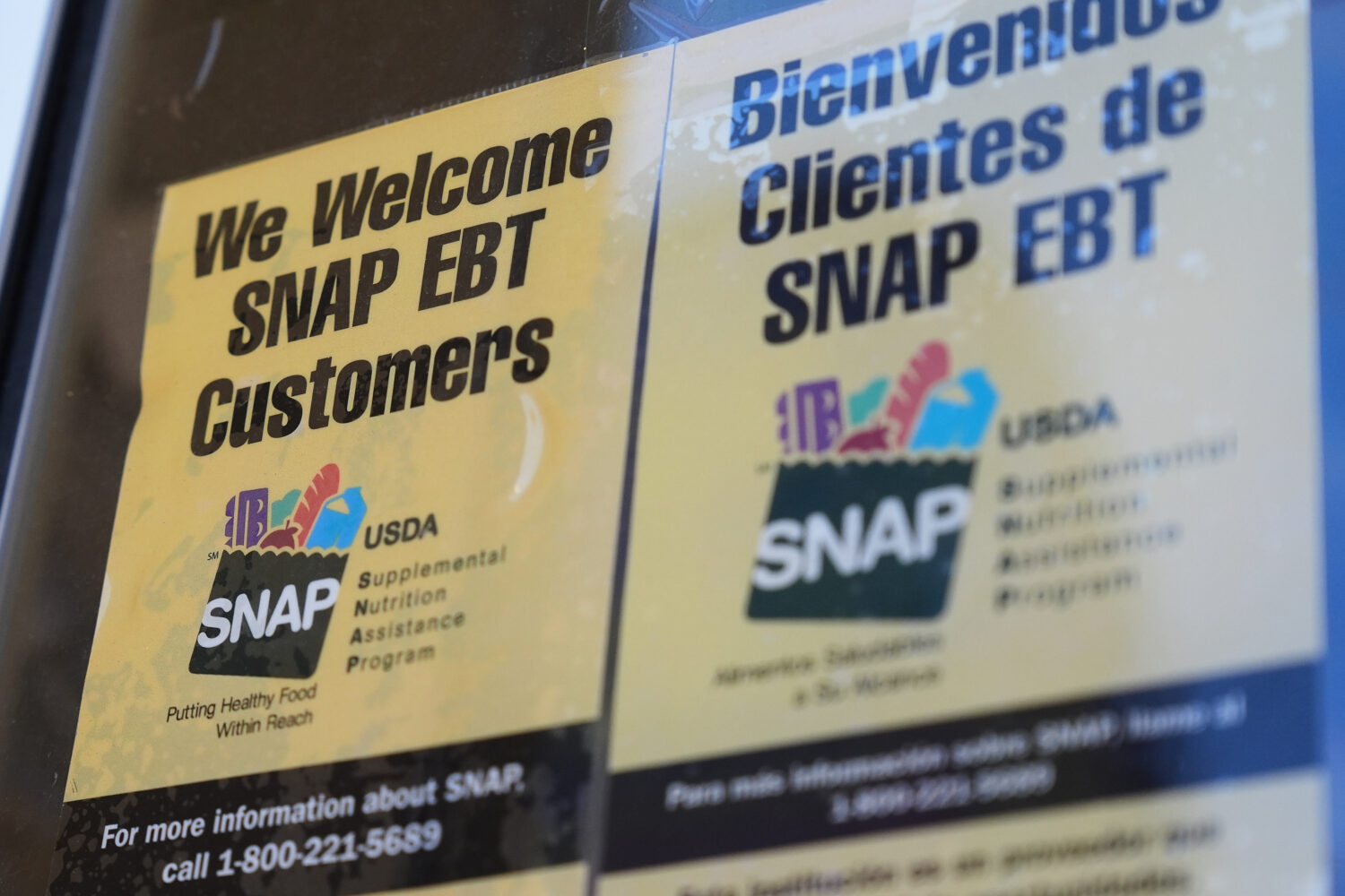 FILE - A SNAP EBT information sign is displayed outside of a convenience store in Baltimore, Monday...