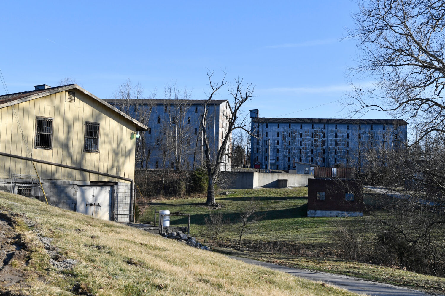 FILE - Bourbon barrel rack houses sit on a hillside at the Four Roses Distillery in Lawrenceburg, K...