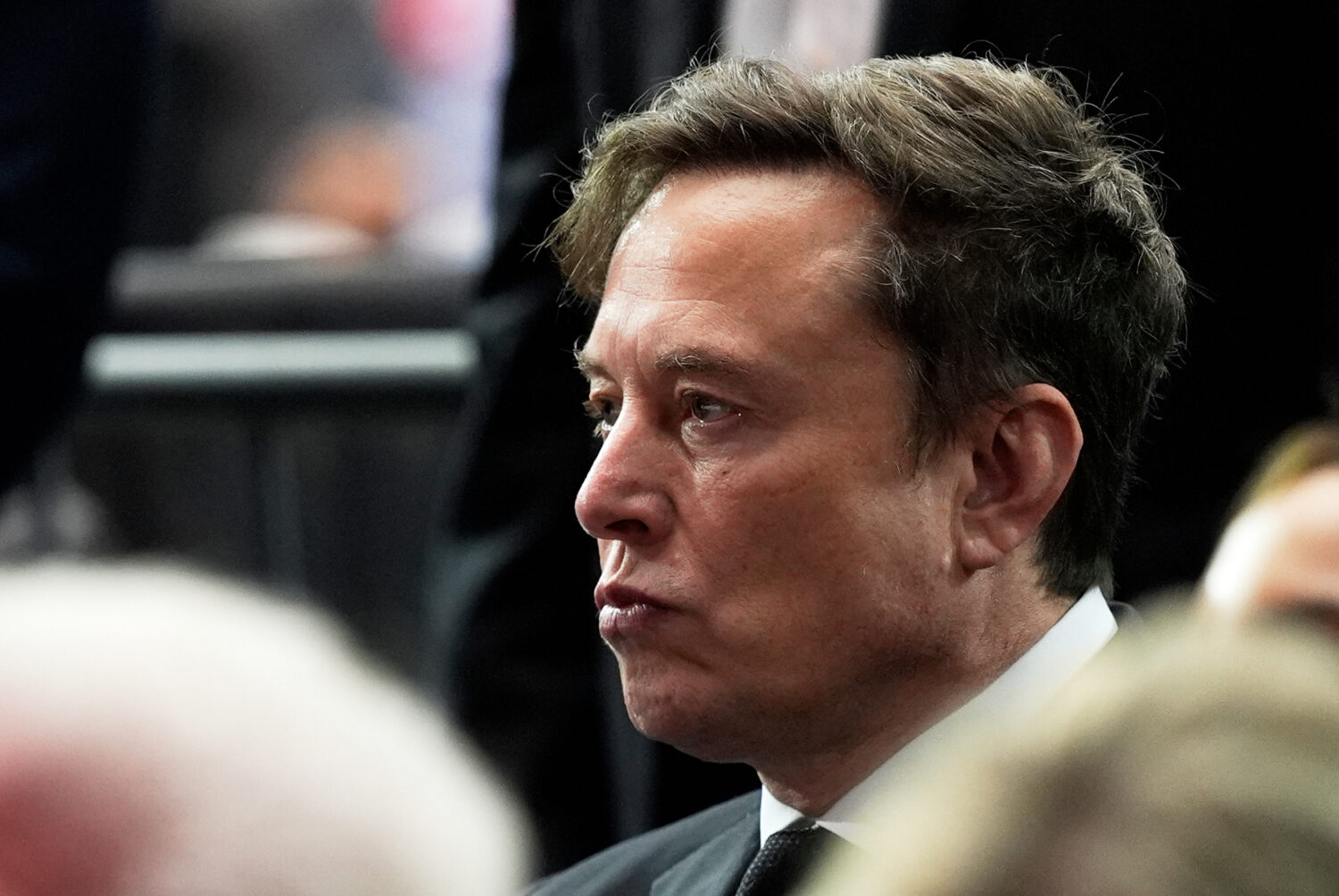 FILE - Elon Musk attends a memorial for conservative activist Charlie Kirk, Sunday, Sept. 21, 2025,...