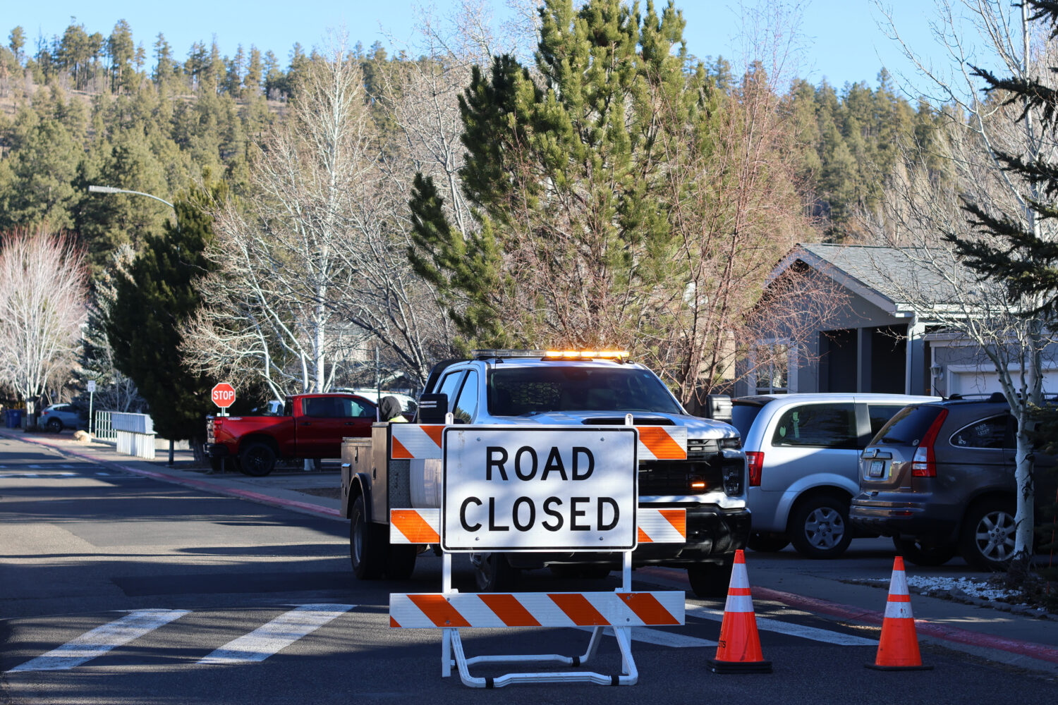 The blocked road to a neighborhood in Flagstaff, Arizona, where police say a man opened fire at off...
