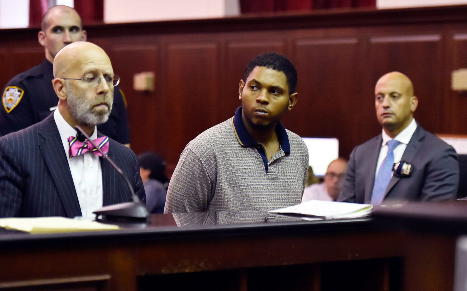 FILE - Randy Santos, center, is arraigned in criminal court for the murder of four homeless men, Oc...